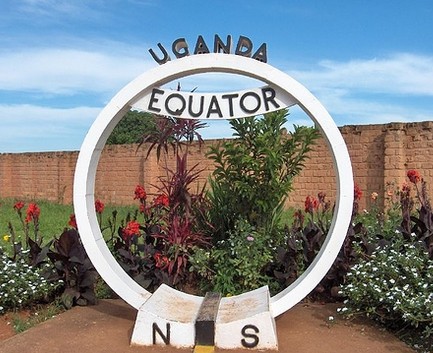 Transfer back to Entebbe with stop at Uganda Equator